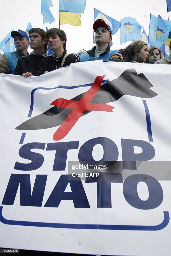 People demonstrate during mass anti-NATO