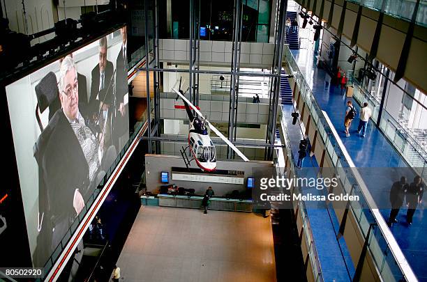 Pulitzer prize-winning photographer Horst Faas can be seen speaking on a large screen in the lobby of the new Newseum during a ceremony at the...