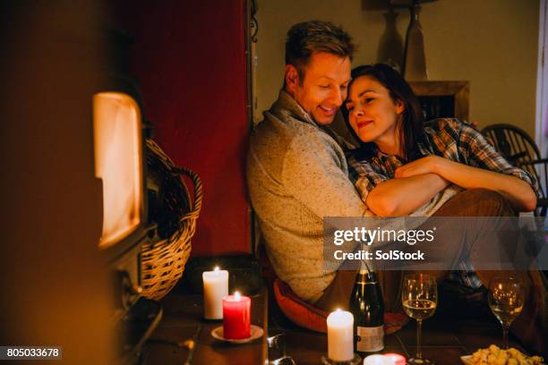 romantic mature couple relaxing at home - date night romance stock pictures, royalty-free photos & images