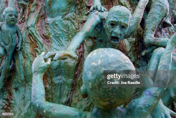 Figurative sculpture, by artist Kenneth Treister, is on display as part of a memorial depicting thousands of victims crawling into an open hand...