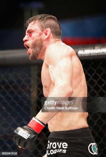 Jon Fitch celebrates defeating Brian Foster in the welterweight main event during Professional Fighters League: Daytona at Daytona International...