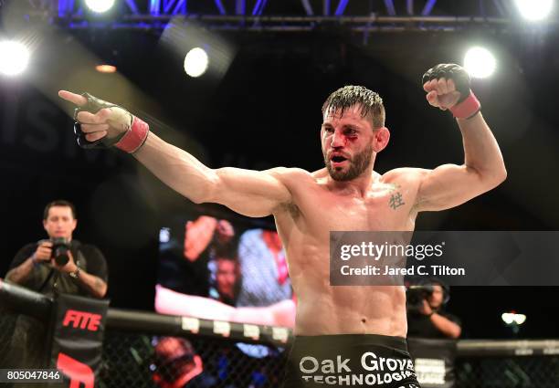 Jon Fitch celebrates defeating Brian Foster in the welterweight main event during Professional Fighters League: Daytona at Daytona International...