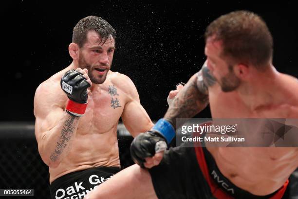 Jon Fitch fights Brian Foster in the welterweight main event during Professional Fighters League: Daytona at Daytona International Speedway on June...