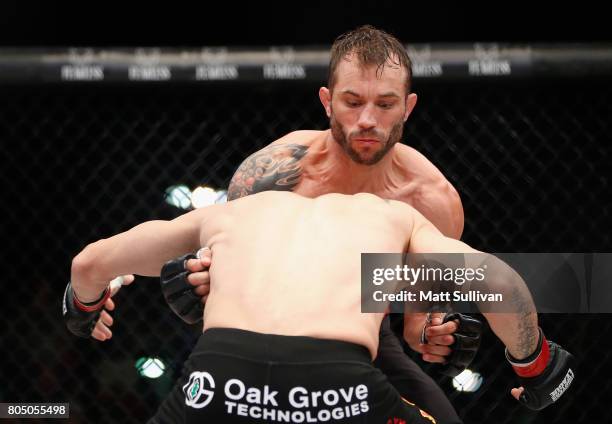 Brian Foster fights Jon Fitch in the welterweight main event during Professional Fighters League: Daytona at Daytona International Speedway on June...