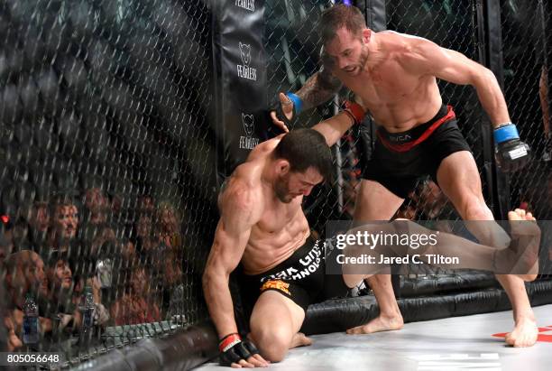 Jon Fitch fights Brian Foster in the welterweight main event during Professional Fighters League: Daytona at Daytona International Speedway on June...