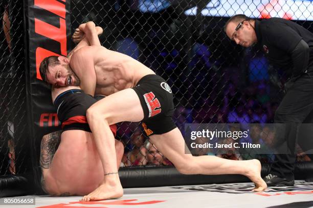 Jon Fitch fights Brian Foster in the welterweight main event during Professional Fighters League: Daytona at Daytona International Speedway on June...