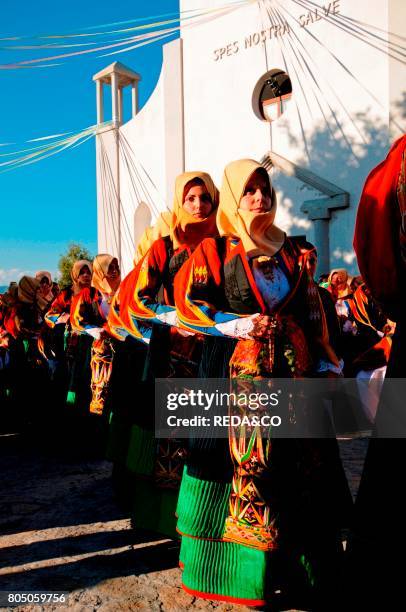 Women with traditional dress at Madonna dell'Assunta procession in Orgosolo.Sardinia.Italy.Europe.