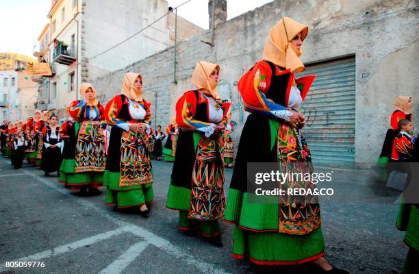 Women with traditional dress at Madonna dell'Assunta procession in Orgosolo.Sardinia.Italy.Europe.