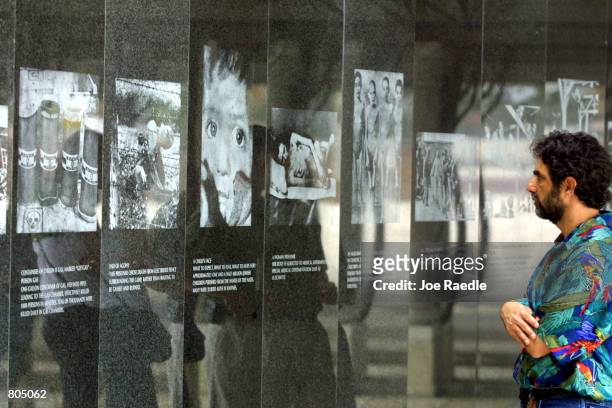 Visitor looks at images from the Holocaust April 29, 2001 at the Holocaust Memorial in South Beach, FL.