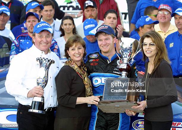 Car owner Richard Childress and wife Judy celebrate in victory lane with driver Dale Earnhardt Jr. And Teresa Earnhardt.