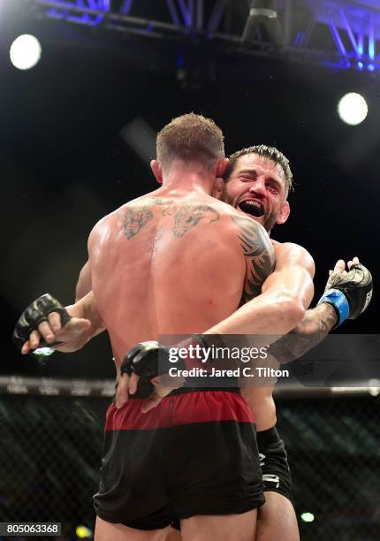 Jon Fitch celebrates after defeating Brian Foster in the welterweight main event during Professional Fighters League: Daytona at Daytona...