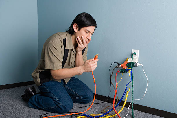 Confused man with power cords