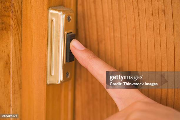 finger pushing doorbell - doorbell stock pictures, royalty-free photos & images