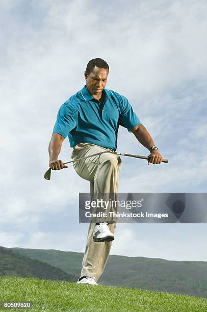 angry golfer bending golf club - angry golfer stock pictures, royalty-free photos & images