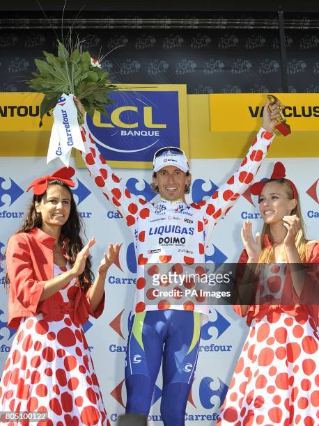 Liquigas's Franco Pellizotti on the podium to collect the polka dot 'King of the Mountains' jersey, after the twentieth stage of the Tour de France...