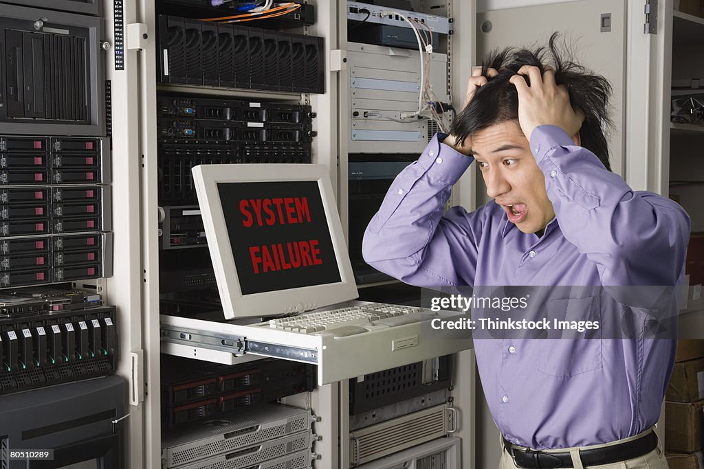 Frustrated Computer Technician With System Failure Message High-Res ...