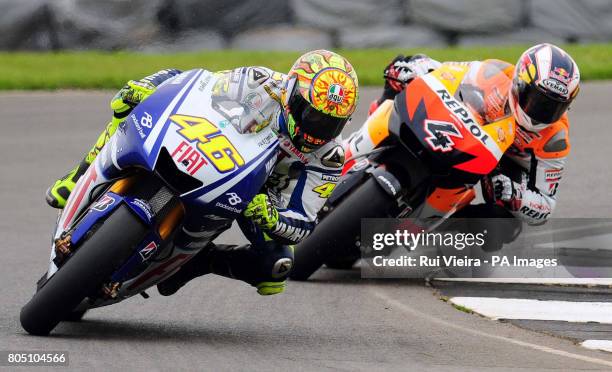 Repsol Honda's Andrea Dovizioso and Yamaha's Valentino Rossi during the British Grand Prix at Donington Park, Castle Donington.