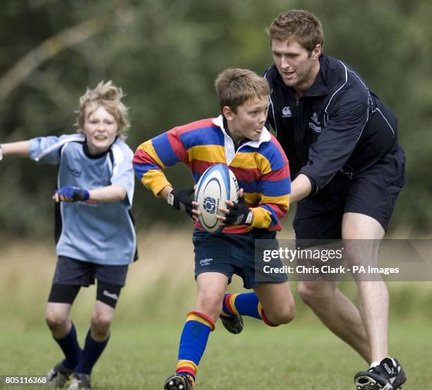 Ritchie Vernon with the young players during the Scottish Rugby Union Summer Camp at Pollok Park in Glasgow.