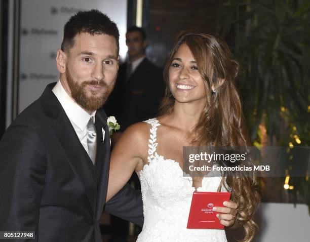 Lionel Messi and Antonela Roccuzzo greet the press after their civil wedding ceremony at the City Center Rosario Hotel & Casino on June 30, 2017 in...