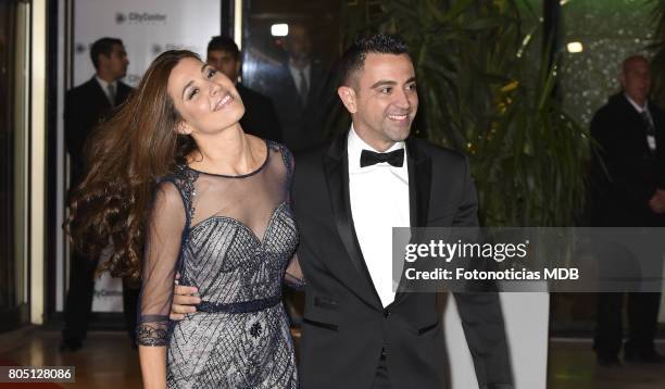 Xavi Hernandez and Nuria Cunillera attend Lionel Messi and Antonela Rocccuzzo's wedding at the City Center Rosario Hotel & Casino on June 30, 2017 in...