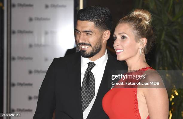 Luis Suarez and Sofia Balbi attend Lionel Messi and Antonela Rocccuzzo's wedding at the City Center Rosario Hotel & Casino on June 30, 2017 in...