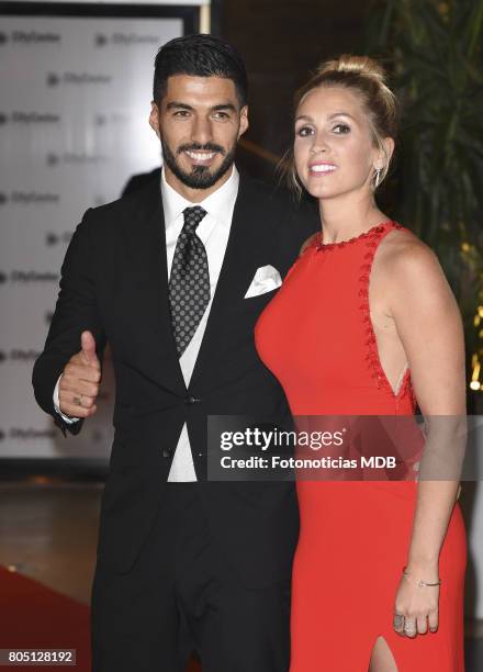 Luis Suarez and Sofia Balbi attend Lionel Messi and Antonela Rocccuzzo's wedding at the City Center Rosario Hotel & Casino on June 30, 2017 in...