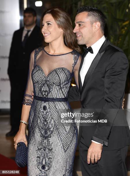 Xavi Hernandez and Nuria Cunillera attend Lionel Messi and Antonela Rocccuzzo's wedding at the City Center Rosario Hotel & Casino on June 30, 2017 in...