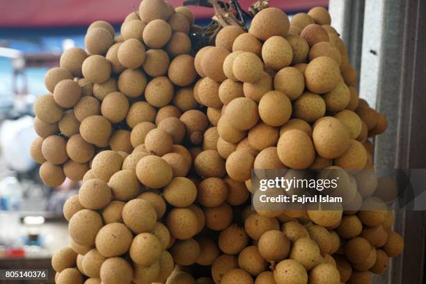 a number of longan in fruit market - longan stock pictures, royalty-free photos & images