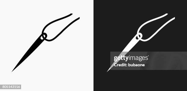 needle and thread icon on black and white vector backgrounds - black thread stock illustrations