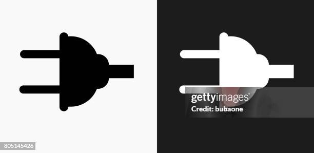 electric plug icon on black and white vector backgrounds - electrician stock illustrations