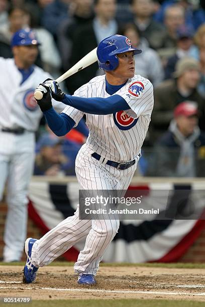 Kosuke Fukudome of the Chicago Cubs makes a hit against the Milwaukee Brewers during the Opening Day game on March 31, 2008 at Wrigley Field in...