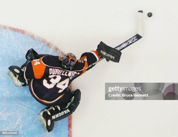 Wade Dubielewicz of the New York Islanders makes the poke check against the New York Rangers on April 3, 2008 at the Nassau Coliseum in Uniondale,...