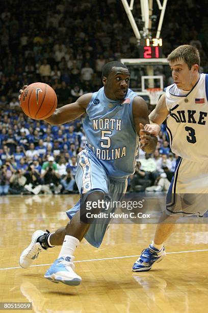 Ty Lawson of the North Carolina Tar Heels drives to the basket against Greg Paulus of the Duke Blue Devils at Cameron Indoor Stadium on March 8, 2008...