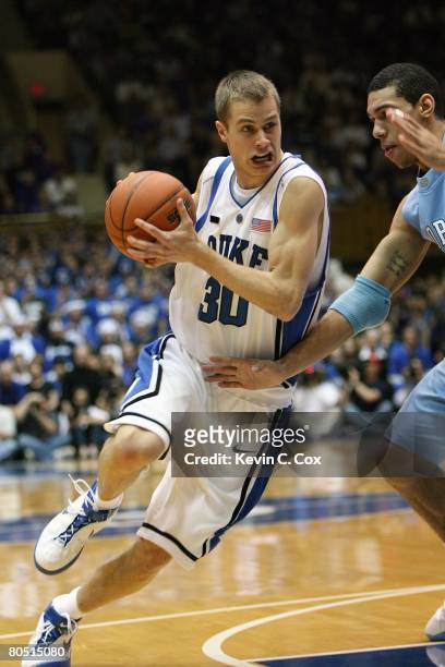 Jon Scheyer of the Duke Blue Devils drives against the North Carolina Tar Heels during the game at Cameron Indoor Stadium on March 8, 2008 in Durham,...