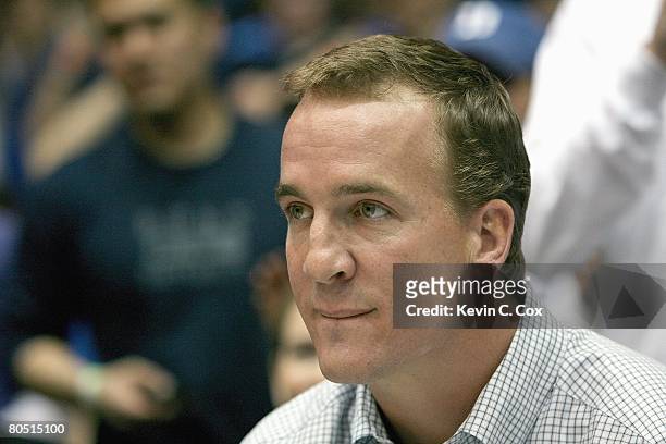 Quarterback Peyton Manning watches the game between the Duke Blue Devils and the North Carolina Tar Heels at Cameron Indoor Stadium on March 8, 2008...
