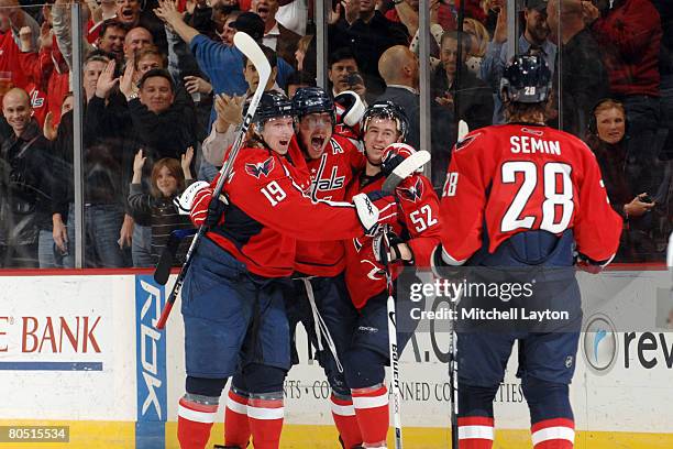 Alex Ovechkin, Nicklas Backstrom, Mike Green and Alexander Semin of the Washington Capitals celebrate the game-winning goal against the Tampa Bay...