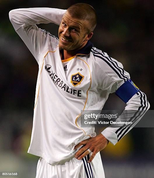 David Beckham of the Los Angeles Galaxy reacts after being tackled by Jason Hernandez of the San Jose Earthquakes in the second half during their MLS...