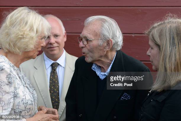 Camilla, Duchess of Cornwall meets war veteran Edward Rose who was incarcerated in Spangenberg Castle with her father Major Bruce Shand, during a...