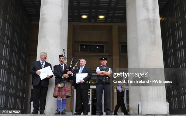 Angus MacMillan, Chairman of Storas Uibhist, piper James MacKay and Angus Campbell, Chairman of the Hebrides Range Taskforce outside the Ministry of...