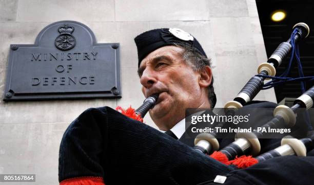 Piper James MacKay outside the Ministry of Defence in London where the Hebrides Range Taskforce delivered letters to the MoD and the Government to...