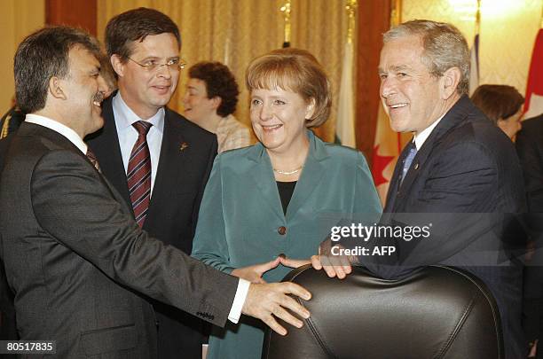 President George W. Bush talks with Turkish President Abdullah Gul, Dutch Prime Minister Jan Peter Balkenende and German Chancellor Angela Merkel as...