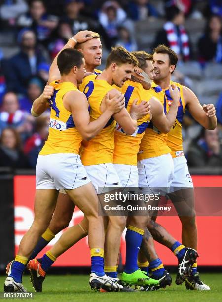 Nathan Vardy of the Eagles is congratulated by team mates after kicking a goal during the round 15 AFL match between the Western Bulldogs and the...