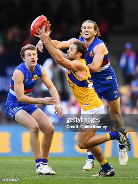 Mark Hutchings of the Eagles and Marcus Bontempelli of the Bulldogs compete for the ball during the round 15 AFL match between the Western Bulldogs...