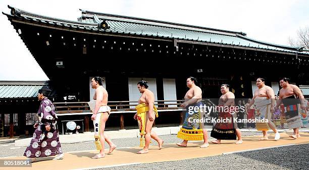 Sumo wrestlers line up before Yasukuni Shrine Dedication Sumo Tournament at Yasukuni Shrine on April 4, 2008 in Tokyo, Japan. Yasukuni Shrine is...