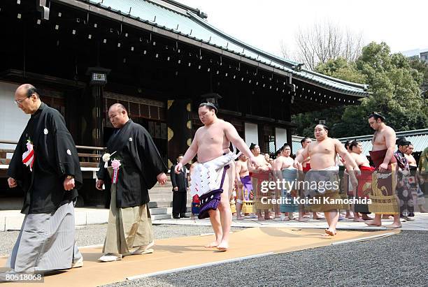 Grand champion Hakuo and Asashoryu of Mongolian wait for the start of Yasukuni Shrine Dedication Sumo Tournament at Yasukuni Shrine on April 4, 2008...