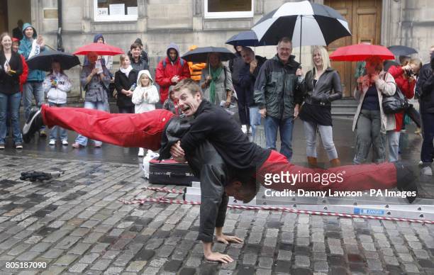 Street performers on Edinburgh's Royal Mile during the Edinburgh Fringe Festival.