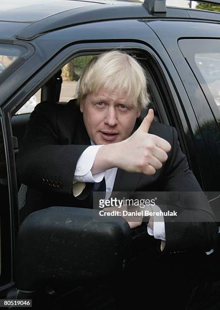 Conservative Party mayoral candidate Boris Johnson gestures as he departs from a visit to the Husseini Mosque in the Mahummedi Park masjid complex in...