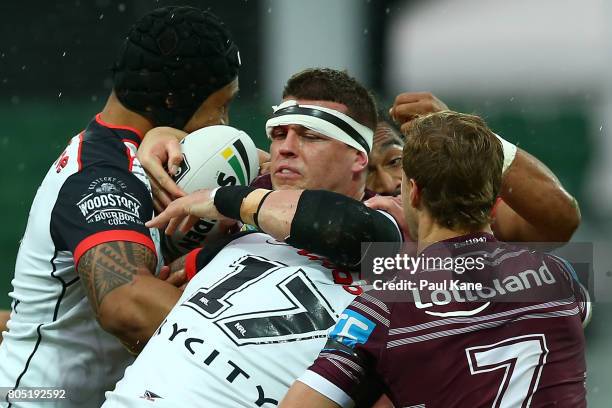 Darcy Lussick of the Sea Eagles gets tackled during the round 17 NRL match between the Manly Sea Eagles and the New Zealand Warriors at nib Stadium...