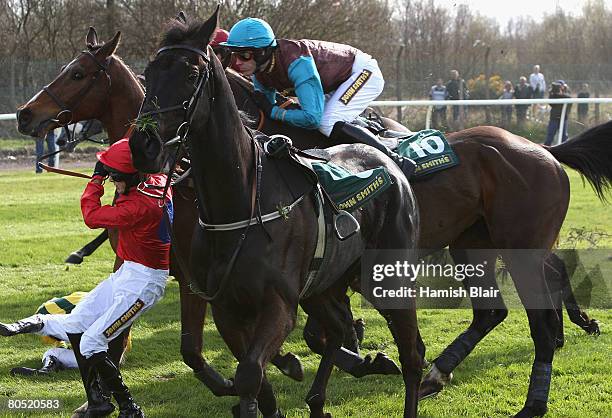 Coleman attempts to get clear of the oncoming horses after falling off Nice Try as they came over Becher's Brook during The John Smith's Topham...