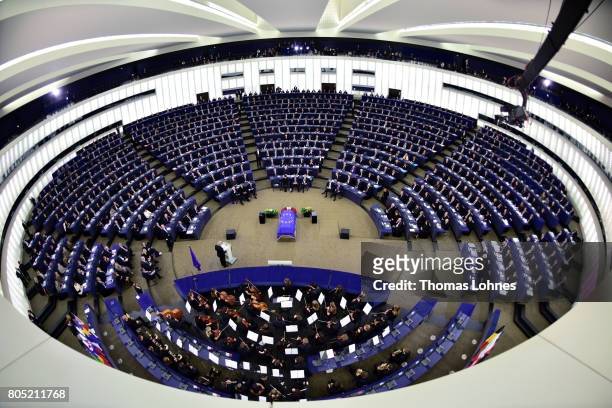 The president of the European Parlament Antonio Tajani speaks as a flag of the European Union lies draped over the coffin of former German Chancellor...